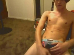 Horny twink strokes his huge cock on webcam